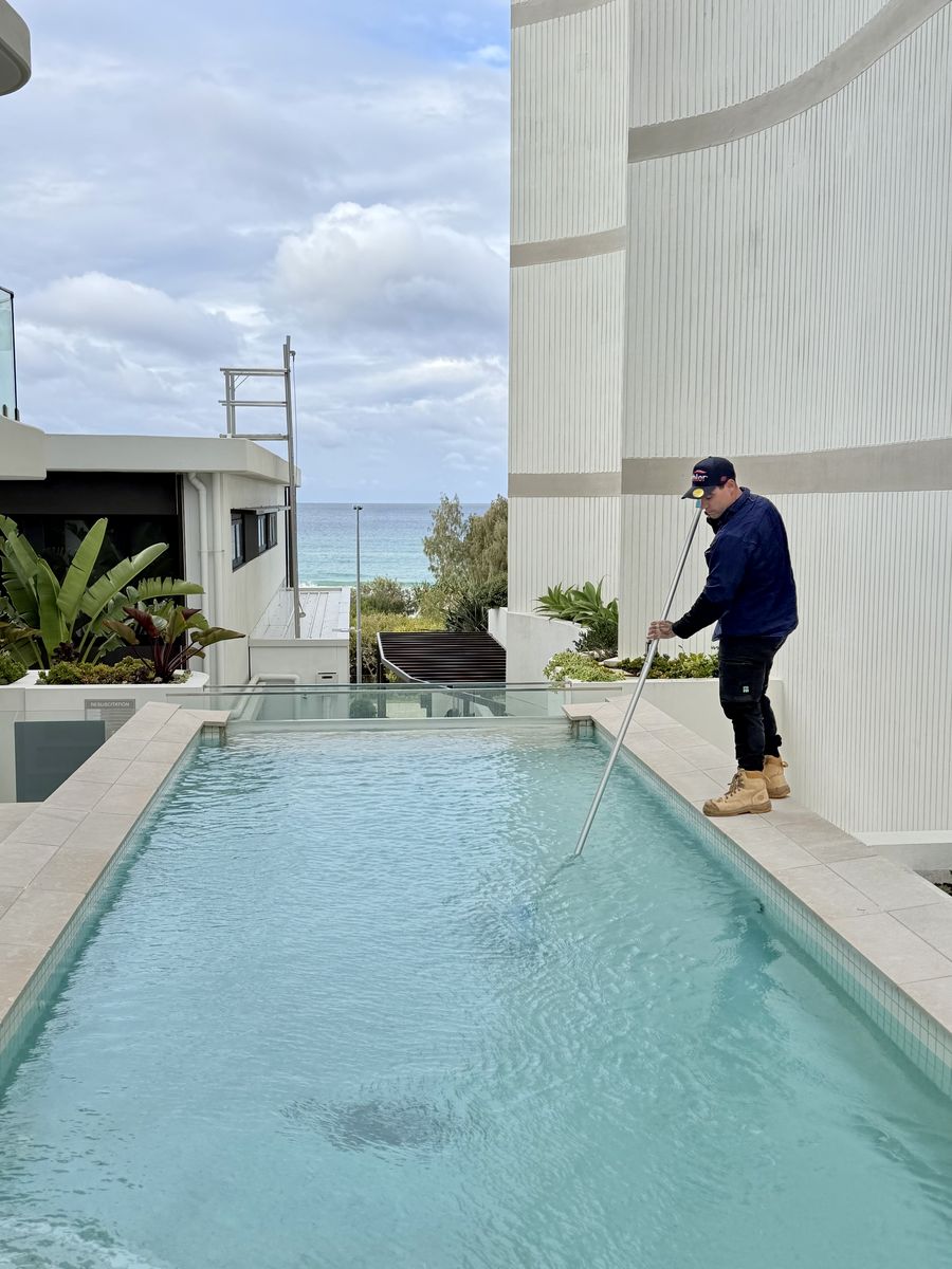 Blue Avenue Pools cleaning a rooftop beachfront pool on the Gold Coast