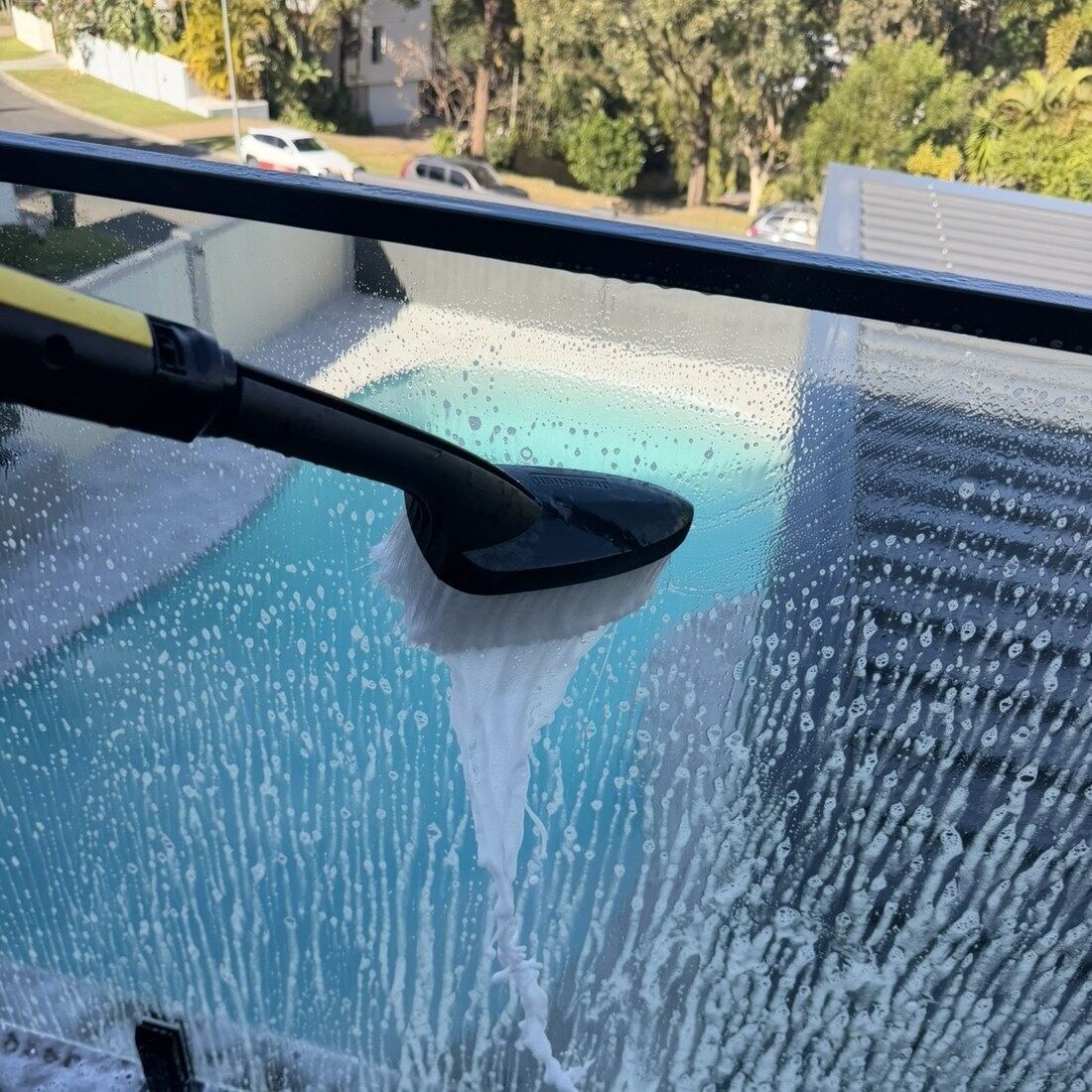 Streak-free glass pool fence cleaned by Blue Avenue Pools